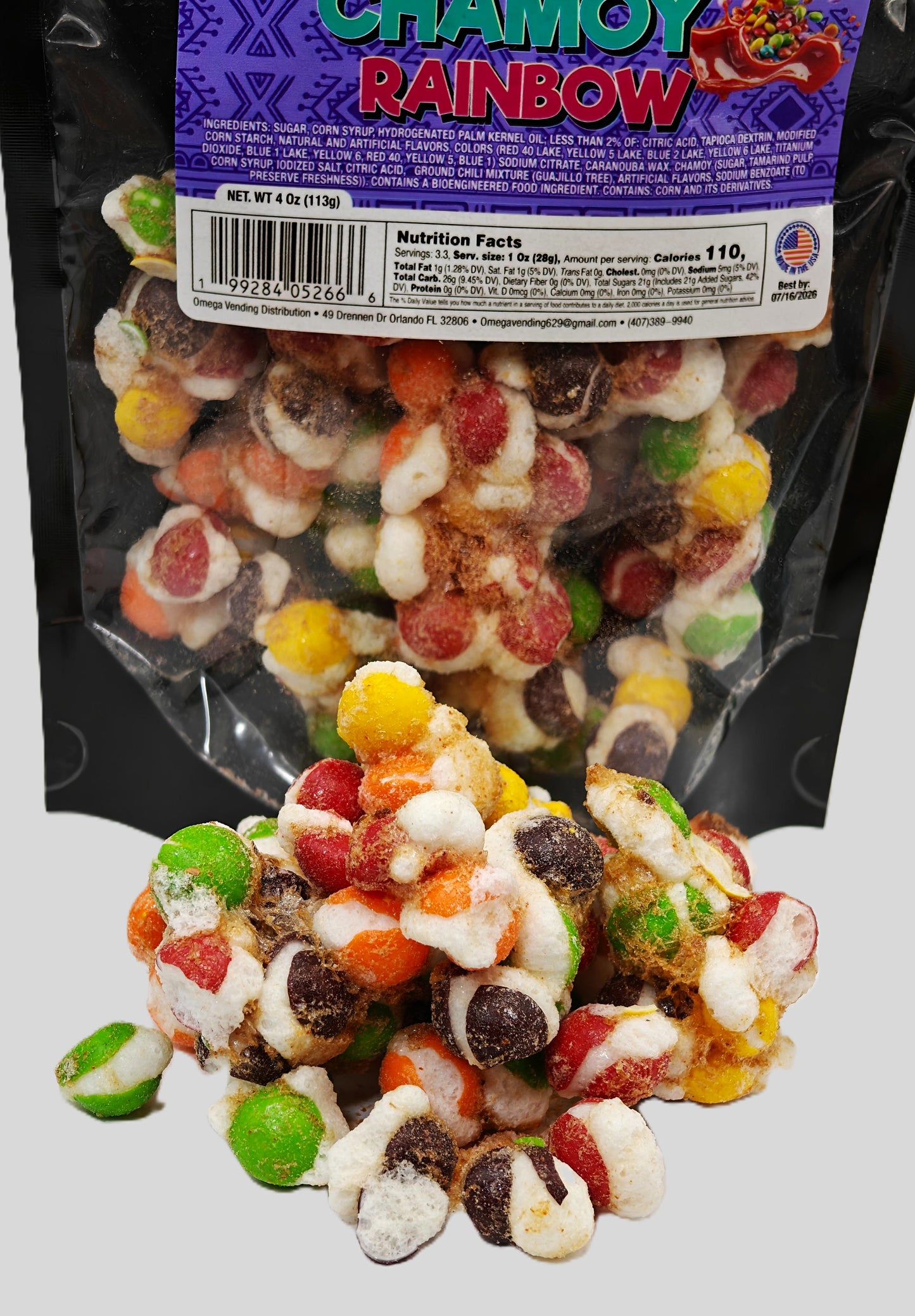 Detailed close-up of Omega Bursts Chamoy Rainbow freeze-dried candy with vibrant gummy pieces spilling in front of the pouch