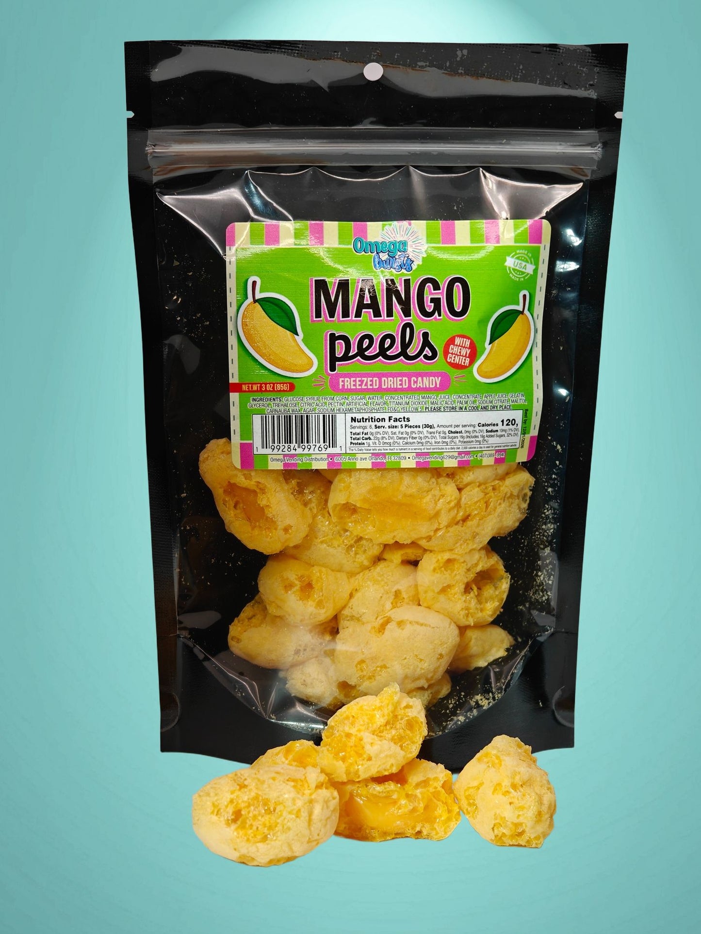 Omega Bursts Mango Peels freeze-dried candy with opened pieces in front of resealable pouch, showing chewy mango center.